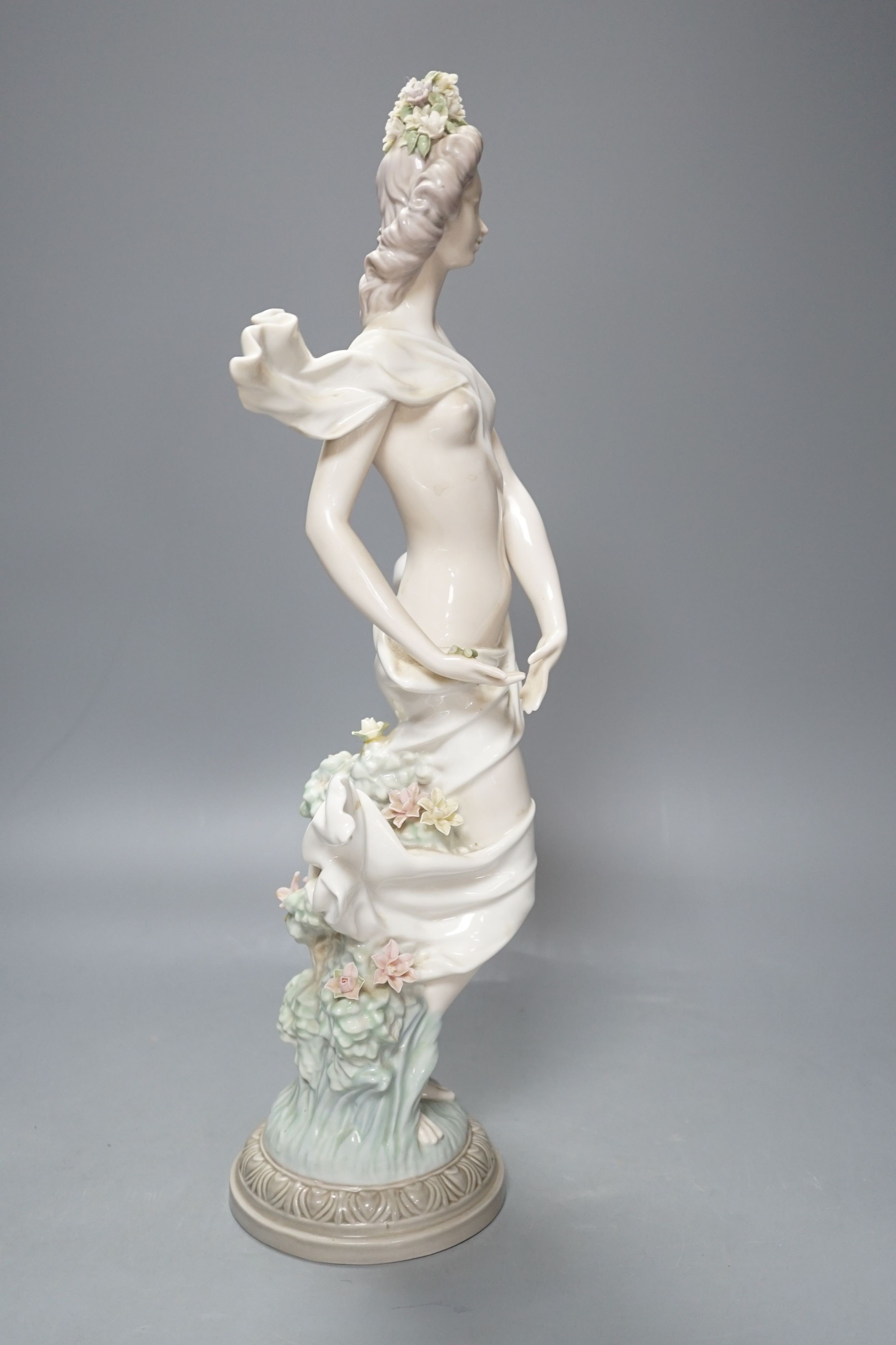 A Lladro female figurine, decorators signature on base, No 401, 41 cms.